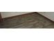 Empty bedroom featuring wood-look floors at 12719 Lockey Ln, Tampa, FL 33612