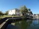 House's backyard with canal access, showing a seawall and dock at 13730 Gene Rossi Ave, Hudson, FL 34667