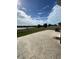 Stamped concrete patio overlooking lake at 14004 Lugano Ct, Hudson, FL 34669