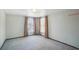 Carpeted bedroom with two windows and neutral walls at 186 Dan River Dr, Spring Hill, FL 34606