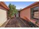 Brick pathway leads to the front door, nestled between building and greenery at 186 Dan River Dr, Spring Hill, FL 34606