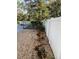 Landscaped backyard with gravel and privacy fence at 1922 Oswego Dr, Holiday, FL 34691