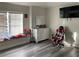 Bedroom with large window, dresser, and gaming chair at 1922 Oswego Dr, Holiday, FL 34691