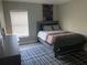 Bedroom with a full-size bed and modern decor at 1922 Oswego Dr, Holiday, FL 34691