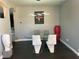 Elegant dining room with a glass-top table and modern chairs at 1922 Oswego Dr, Holiday, FL 34691