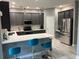 Eat-in kitchen featuring stainless steel appliances and a breakfast bar at 1922 Oswego Dr, Holiday, FL 34691