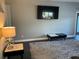 Living room showcasing a large TV and modern decor at 1922 Oswego Dr, Holiday, FL 34691