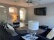 Spacious living room with a large TV and comfortable seating at 1922 Oswego Dr, Holiday, FL 34691