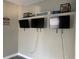 Game room with mounted TVs and sports memorabilia at 1922 Oswego Dr, Holiday, FL 34691
