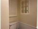 Simple bathroom with white toilet and window shutters at 21146 Fountain View Ln # 4102, Lutz, FL 33558