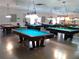 Community game room with multiple billiard tables at 2360 World Parkway Blvd # 4, Clearwater, FL 33763