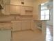 Bright kitchen with granite countertops and ample cabinet space at 2360 World Parkway Blvd # 4, Clearwater, FL 33763