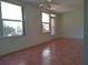 Bright living room with tile floors and large windows at 2360 World Parkway Blvd # 4, Clearwater, FL 33763