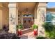 Elegant entryway with double doors and decorative planters at 247 Oriana Dr, Spring Hill, FL 34609