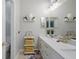 Modern bathroom with double vanity, quartz countertop, and stylish decor at 3042 Wentworth Way, Tarpon Springs, FL 34688
