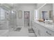 Elegant bathroom with marble finishes and double vanity at 3042 Wentworth Way, Tarpon Springs, FL 34688