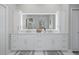 Bright bathroom with double vanity and modern lighting at 3042 Wentworth Way, Tarpon Springs, FL 34688