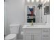 Clean bathroom with white vanity and gold accents at 3042 Wentworth Way, Tarpon Springs, FL 34688