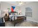 Comfortable bedroom with king-size bed and wood floors at 3042 Wentworth Way, Tarpon Springs, FL 34688