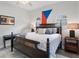 Comfortable bedroom with king-size bed and wood floors at 3042 Wentworth Way, Tarpon Springs, FL 34688