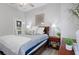 Bedroom with a queen bed, nightstands, and access to a small kitchenette at 3042 Wentworth Way, Tarpon Springs, FL 34688