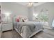Serene bedroom featuring a queen-size bed and light gray bedding at 3042 Wentworth Way, Tarpon Springs, FL 34688