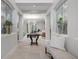 Elegant entryway with tiled floors, stained glass windows, and a bench at 3042 Wentworth Way, Tarpon Springs, FL 34688
