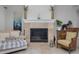 Cozy living room with stone fireplace and comfortable seating at 3042 Wentworth Way, Tarpon Springs, FL 34688
