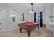 Game room featuring a pool table and stained glass windows at 3042 Wentworth Way, Tarpon Springs, FL 34688