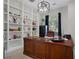 Elegant home office with built-in shelving and a large desk at 3042 Wentworth Way, Tarpon Springs, FL 34688