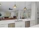 Kitchen with island, double sink, and stainless steel dishwasher at 3042 Wentworth Way, Tarpon Springs, FL 34688