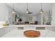 Open kitchen with breakfast bar overlooking the living room at 3042 Wentworth Way, Tarpon Springs, FL 34688