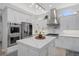 Modern kitchen featuring stainless steel appliances and marble countertops at 3042 Wentworth Way, Tarpon Springs, FL 34688
