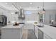 Spacious kitchen with white cabinets, stainless steel appliances, and a large island at 3042 Wentworth Way, Tarpon Springs, FL 34688