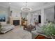 Living room with fireplace, seating area, and large windows at 3042 Wentworth Way, Tarpon Springs, FL 34688