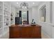 Bright home office with built-in shelves and a large desk at 3042 Wentworth Way, Tarpon Springs, FL 34688