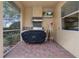 Outdoor kitchen with a Blackstone grill and stainless steel appliances at 3042 Wentworth Way, Tarpon Springs, FL 34688
