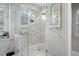 Large walk-in shower with marble tile and glass enclosure at 3042 Wentworth Way, Tarpon Springs, FL 34688