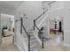 Grand staircase leading to upper level with views to game room at 3042 Wentworth Way, Tarpon Springs, FL 34688