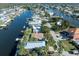 Aerial view showing a canal front home with a private dock at 3291 Minnow Creek Dr, Hernando Beach, FL 34607