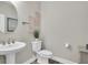 Small powder room with pedestal sink and toilet at 3337 Heart Pine Ave, Odessa, FL 33556