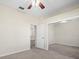 Bedroom with mirrored closet and access to bathroom at 4327 Canongate Ct, Spring Hill, FL 34609