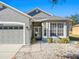 House entrance with double doors and a bay window at 4327 Canongate Ct, Spring Hill, FL 34609