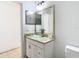 Bathroom boasts granite vanity, glass vessel sink, and tiled floors at 4503 Courtland St # 1, Tampa, FL 33610