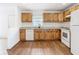 Modern kitchen featuring wood cabinets and granite countertops at 4503 Courtland St # 1, Tampa, FL 33610