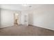Large carpeted bedroom with an ensuite bathroom at 4620 Tri Par Dr, Sarasota, FL 34234