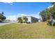 Single-wide manufactured home with a spacious yard at 4620 Tri Par Dr, Sarasota, FL 34234