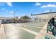 Outdoor shuffleboard courts with covered seating areas at 4620 Tri Par Dr, Sarasota, FL 34234