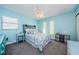 Light and airy bedroom with a ceiling fan and soft blue color scheme at 7509 Cypress Knee Dr, Hudson, FL 34667