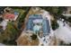 Aerial view of a home with a large backyard, swimming pool, and detached garage at 7941 Sycamore Dr, New Port Richey, FL 34654